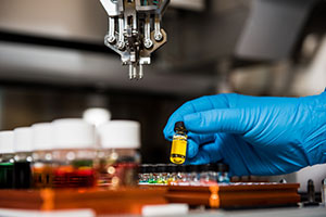 test tubes being filled in a lab